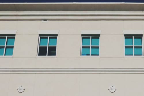 A square view of the windows on the east side of the Harrisonburg City Schools building in Harrisonburg, VA.